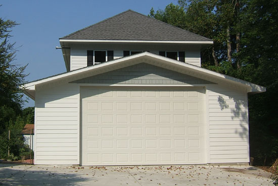 To see a detailed gallery of the stages of the construction of this large custom detached garage, click here now.
