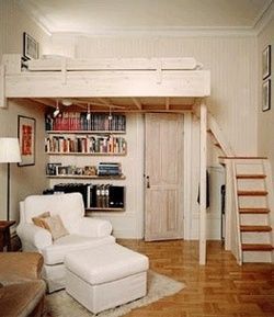 garage converted in to a sleeping area with a loft
